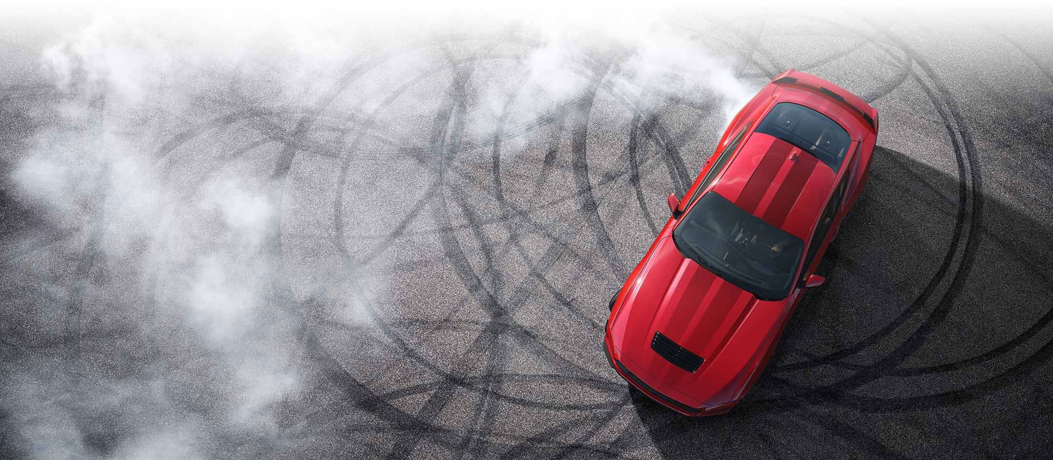 Overhead view of a 2024 Ford Mustang® model with tire tracks on pavement | Wyatt Johnson Ford in Nashville TN